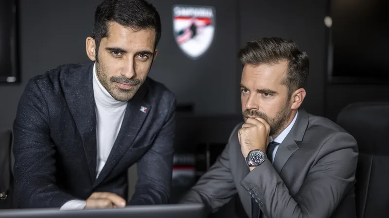 Américo Branco to Become Sampdoria's New Sporting Director Américo Branco and Jesper Fredberg in a meeting, with Sampdoria branding in the background.