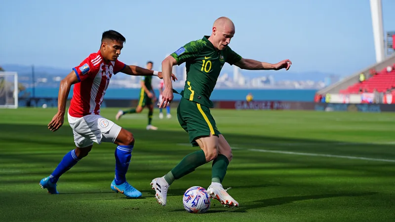 Soccer players from Australia and Paraguay compete during a match in San Francisco.