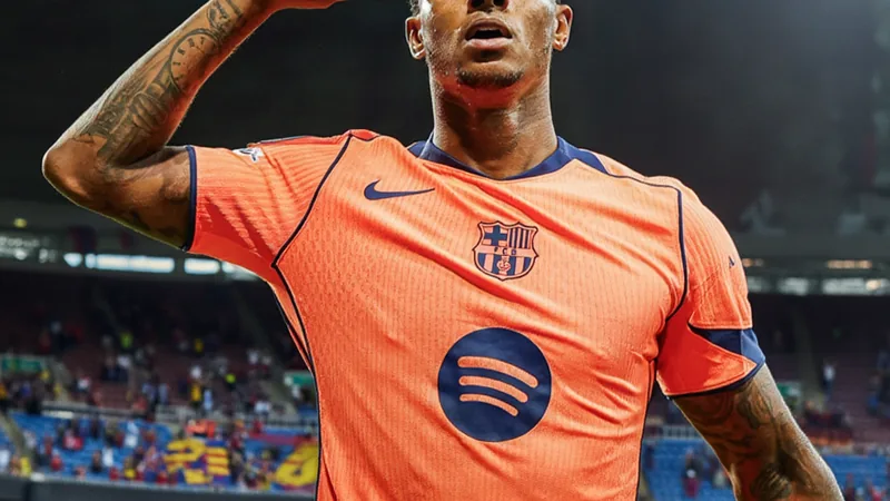 Marcus Rashford in Barcelona kit during a match, with Camp Nou in background