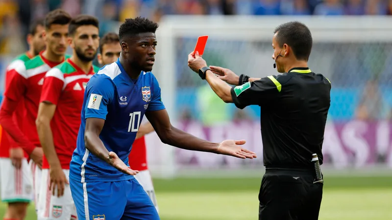 Ngoy red card leaves Belgium with 10 men Soccer player Nathan Ngoy receiving a red card from the referee during a match against Iran. — latest news and analysis.