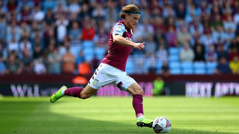 Christie and Rooney on John McGinn — latest news and analysis John McGinn in action on the football pitch during a match.