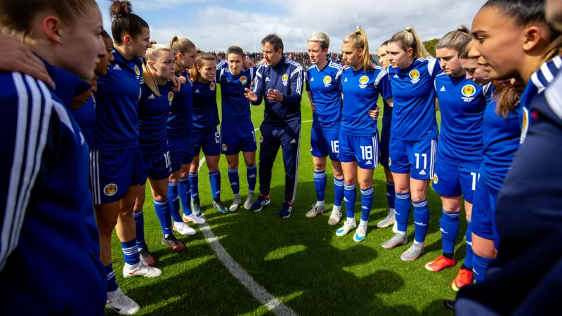 Clarke aims to break Scotland's World Cup barrier Scotland women's football team huddles before a match, with coach Pedro Martinez Losa addressing players on the pitch. — latest news and analysis.