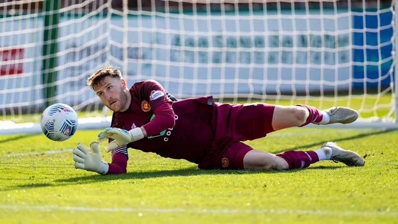 Craig Gordon in goal for Heart of Midlothian, making a save during a match against Dundee.