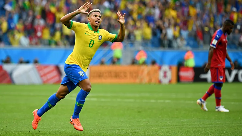 Matheus Cunha celebrates after scoring for Brazil against Haiti in a World Cup match.