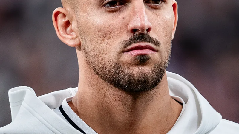 Dani Ceballos in Real Madrid kit, looking pensive as he prepares to leave the club as a free agent. — latest news and analysis.