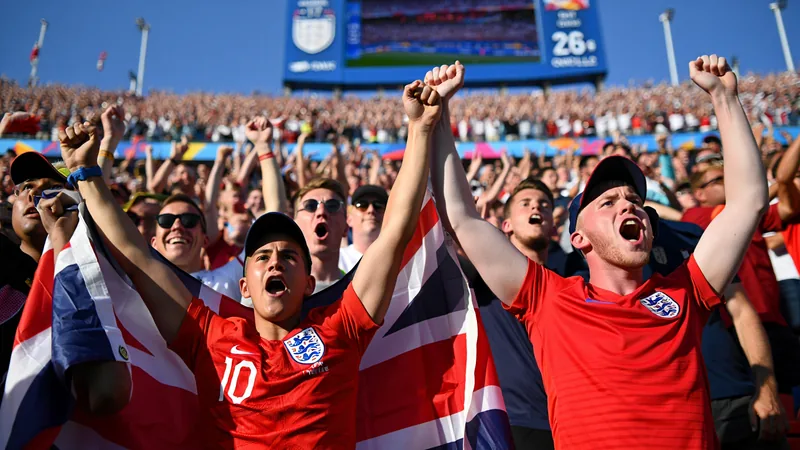 England football fans celebrating a goal at the World Cup, with a darts-themed song playing in the background. — latest news and analysis.