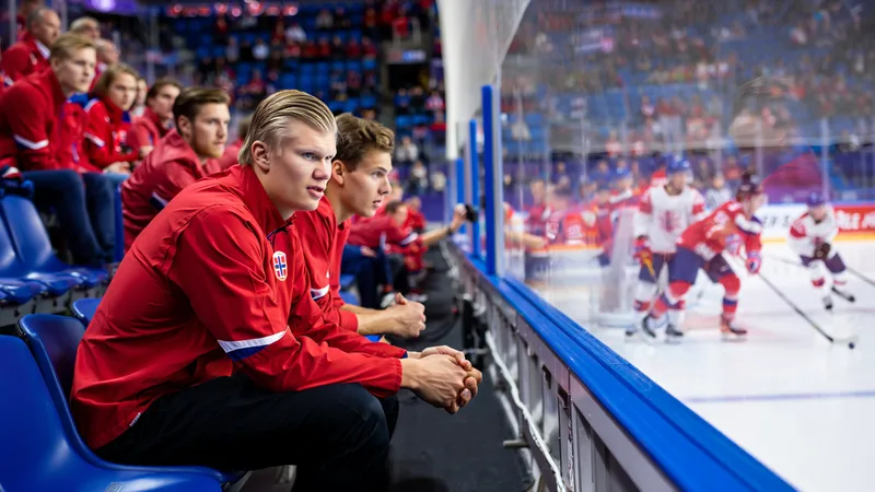 Haaland attends ice hockey match before World Cup debut Erling Haaland and Norway teammates watching an ice hockey game from the stands.