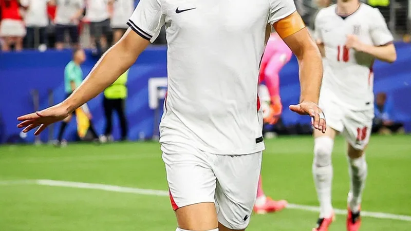 Harry Kane celebrating after scoring for England at the World Cup