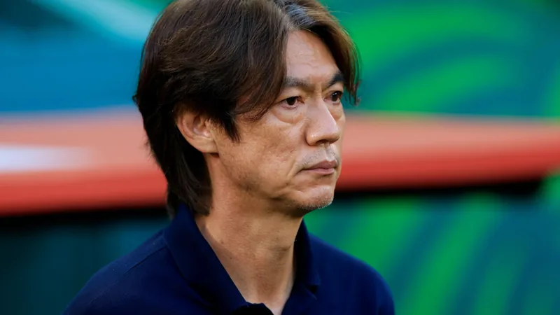 Hong Myungbo at a press conference announcing his resignation as South Korea national football team coach after the 2026 World Cup.