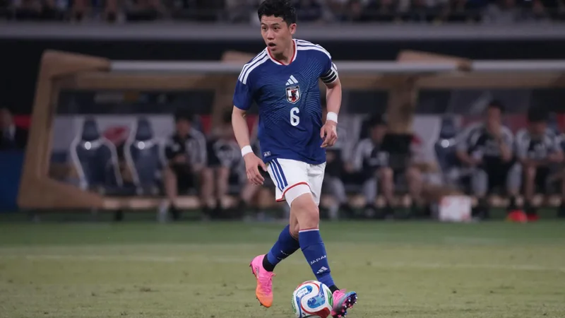 Japan captain Wataru Endo in action during a match, now ruled out of the World Cup with a foot injury — latest news and analysis.