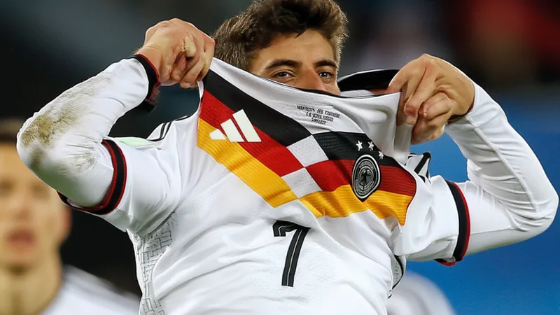 Kai Havertz of Germany looks thoughtful during a press conference, reflecting on the team's recent tournament performances.