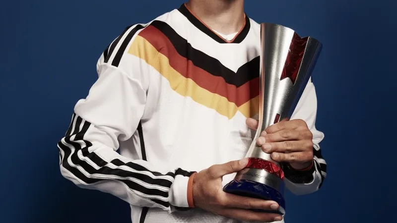 Kai Havertz holding a Man of the Match award after Germany vs Curaçao
