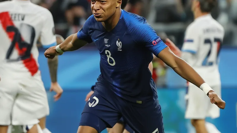 Kylian Mbappé's World Cup Career: Stats and Achievements Kylian Mbappé celebrating a goal in a France jersey during a World Cup match, with fans cheering in the background. — latest news and analysis.