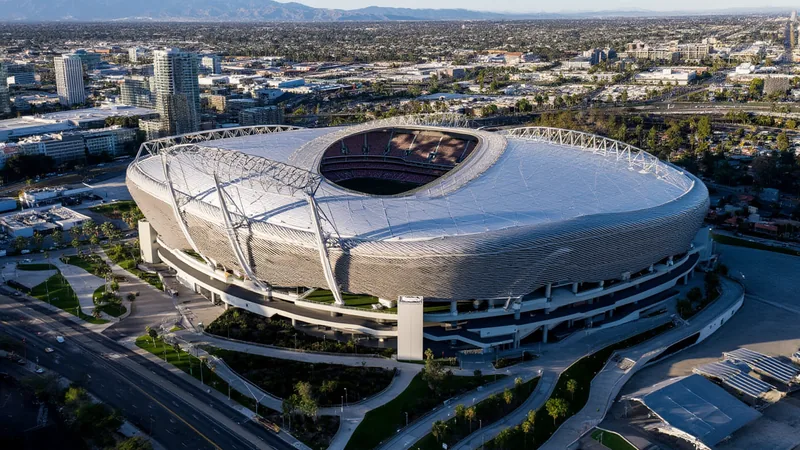 Aerial view of SoFi Stadium in Inglewood, California, with the surrounding cityscape and mountains in the background. — latest news and analysis.