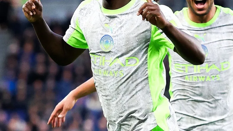 Manchester City agree new deal with Jeremy Doku Jeremy Doku in Manchester City kit celebrating on the pitch