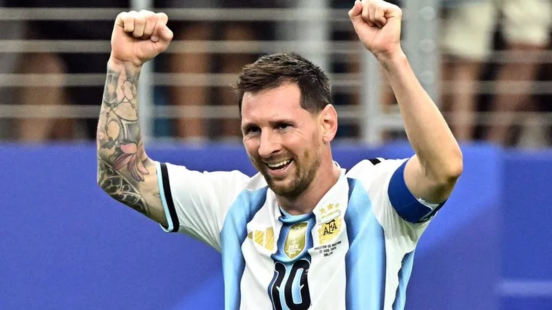 Messi's Argentina career surpasses club feats after World Cup win Lionel Messi celebrating with the World Cup trophy, surrounded by Argentina teammates in a stadium. — latest news and analysis.