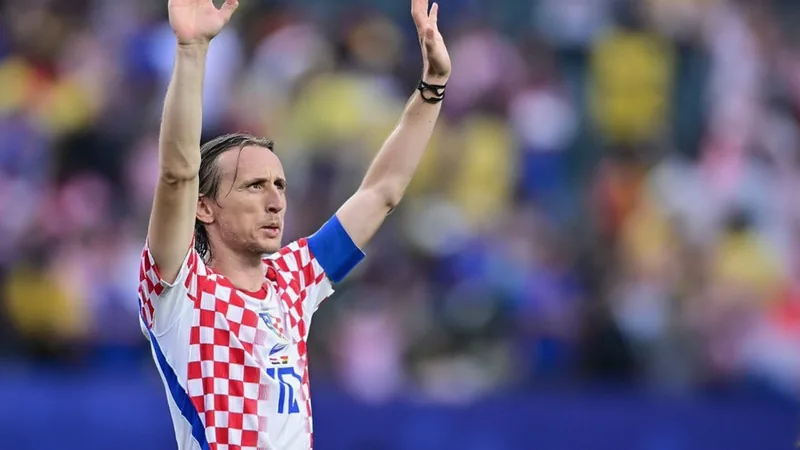 Luka Modrić celebrating on the pitch after providing an assist in a World Cup match for Croatia. — latest news and analysis.