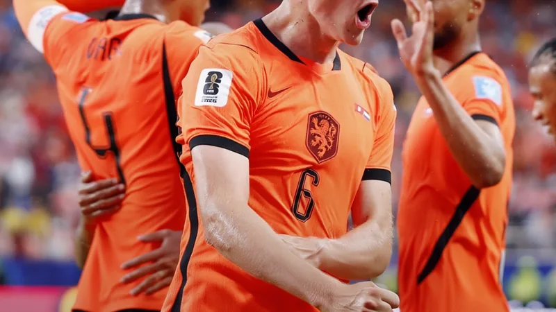 Netherlands football team celebrating qualification for the World Cup Round of 32
