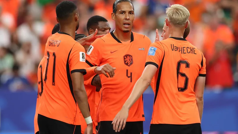 Netherlands and Morocco players competing for the ball during a World Cup match, with fans in the background. — latest news and analysis.