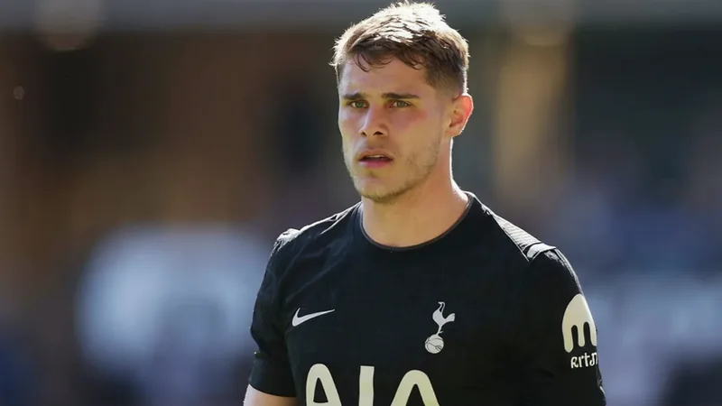 No Liverpool or Barcelona move for Micky van de Ven Micky van de Ven in Tottenham Hotspur kit, looking focused on the pitch.