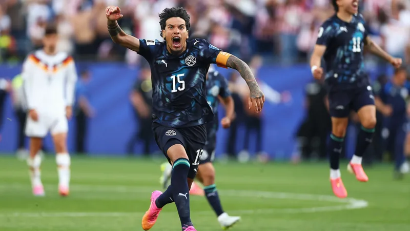 Paraguay players celebrate after winning a penalty shootout against Germany in the FIFA World Cup 2026 Round of 32 match.