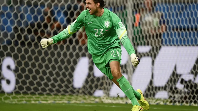 Goalkeeper Tim Krul in action during a penalty shoot-out, showcasing modern techniques and psychological tactics. — latest news and analysis.