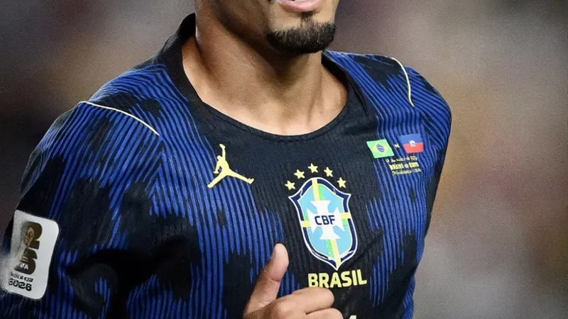 Brazil's Raphinha being substituted off the pitch due to injury during a World Cup match.