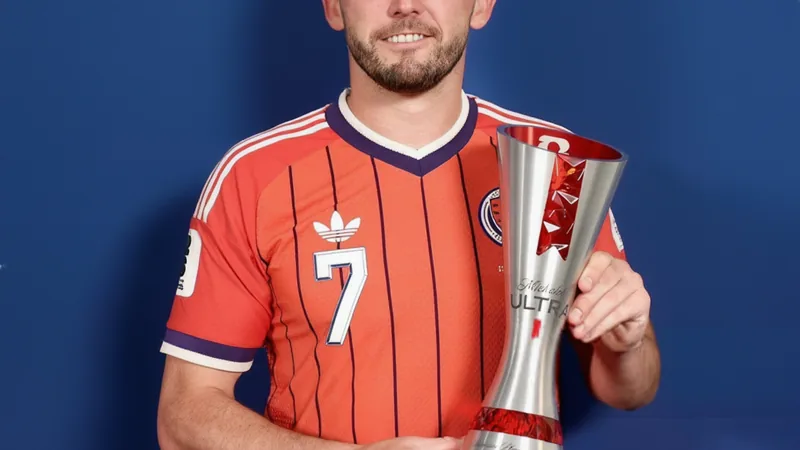 Scott McGinn holding Man of the Match award after Scotland-Haiti FIFA match