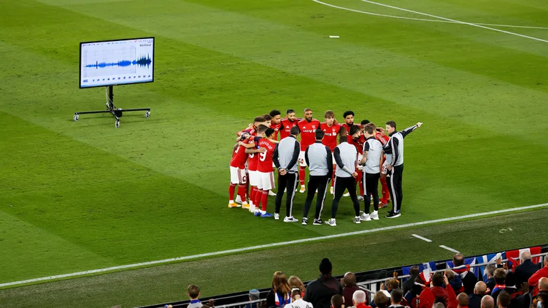 Snicko technology used to award Sweden goal at World Cup A football match scene with a VAR screen showing a waveform spike indicating a touch on the ball, with players and officials on the field.