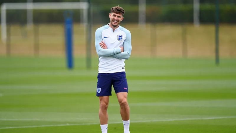 Stones: England call-up excitement never fades John Stones in England training kit, smiling during a session