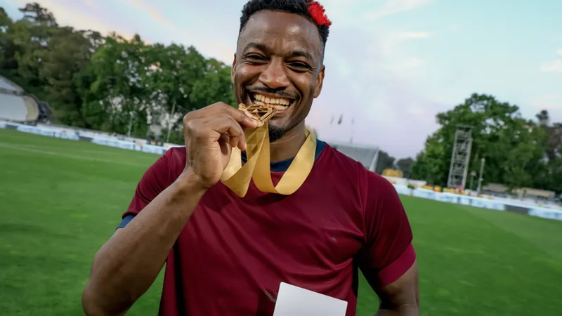 Cabo Verde defender Stopira in national team kit, smiling, with a football field in the background. — latest news and analysis.