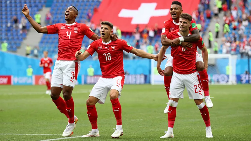 Switzerland players celebrate after defeating Canada in a World Cup group match.