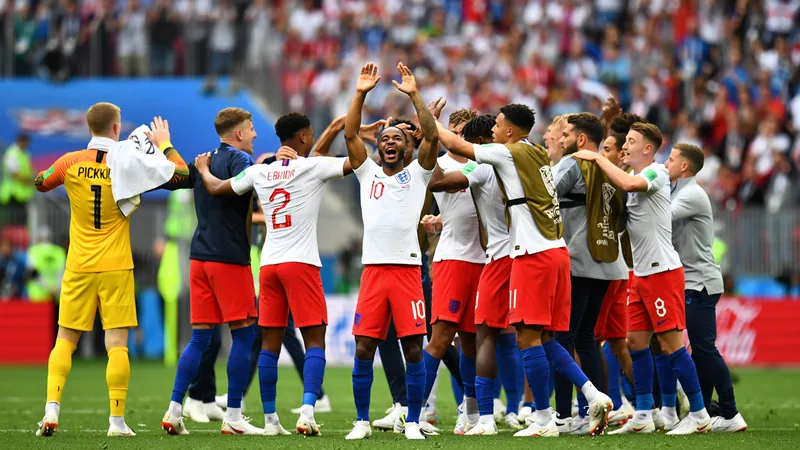 England players celebrating their 4-2 win against Croatia in a football match.