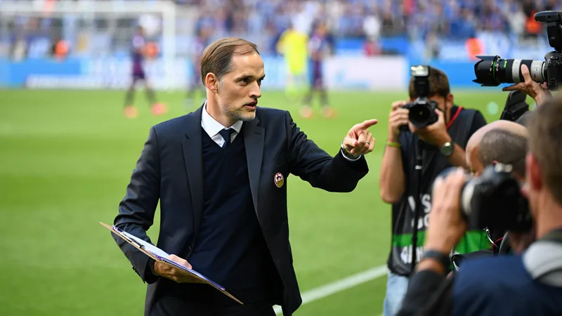 Tuchel's photographer complaints prompt Fifa changes Thomas Tuchel on the sidelines during a match, with photographers positioned nearby, illustrating the issue that led to Fifa's changes.
