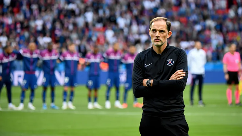 Thomas Tuchel looking displeased during the national anthem at a World Cup match.