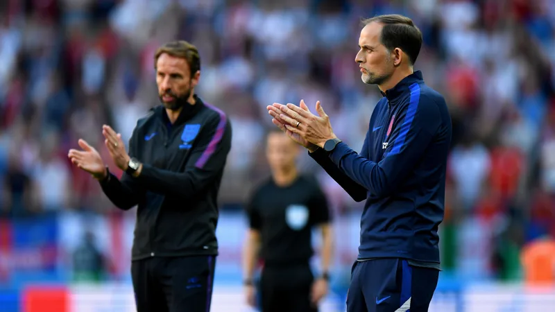 Thomas Tuchel and Gareth Southgate on the sidelines during England matches, illustrating contrasting coaching philosophies.