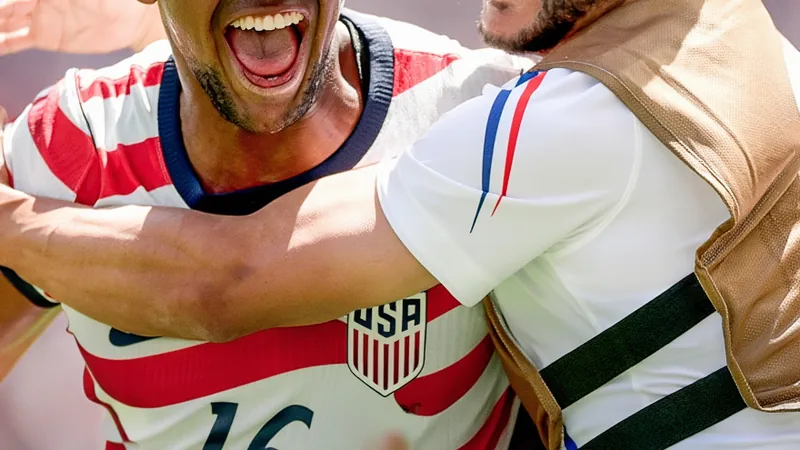 USMNT beats Australia 2-0, qualifies for World Cup RO32 USMNT players celebrating their 2-0 victory over Australia in a World Cup match.