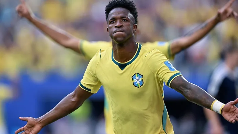 Brazilian footballer Vinícius Jr. speaking during a press conference, wearing Brazil national team jersey. — latest news and analysis.