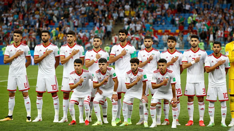 White House in talks over Iran World Cup travel restrictions Iranian football players in white jerseys on a field during a World Cup match, with a stadium crowd in the background. — latest news and analysis.
