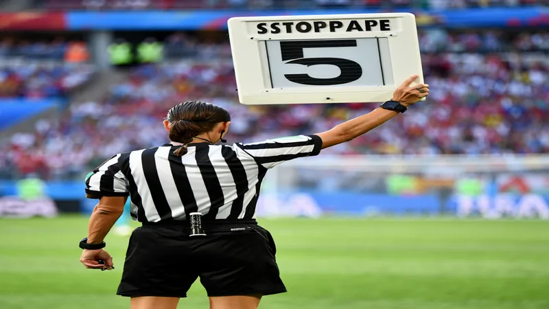 World Cup stoppage time: Why matches are shorter in 2026 A football referee holds up a stoppage time board showing 5 minutes during a World Cup match. — latest news and analysis.