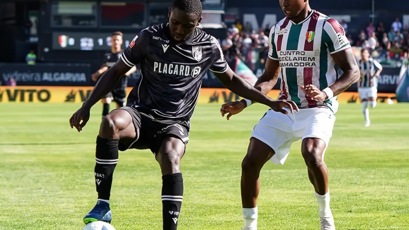 AEK Athens Makes Initial Approach for Beni Mukendi Beni Mukendi in action on the football pitch, wearing a team jersey.