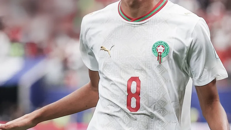 Ajax in talks to sign Azzedine Ounahi with €25m release clause Ajax logo and Azzedine Ounahi in action for Morocco national team