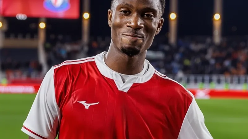 Aladji Bamba in action during a match, with AS Monaco and Newcastle United logos in the background. — latest news and analysis.