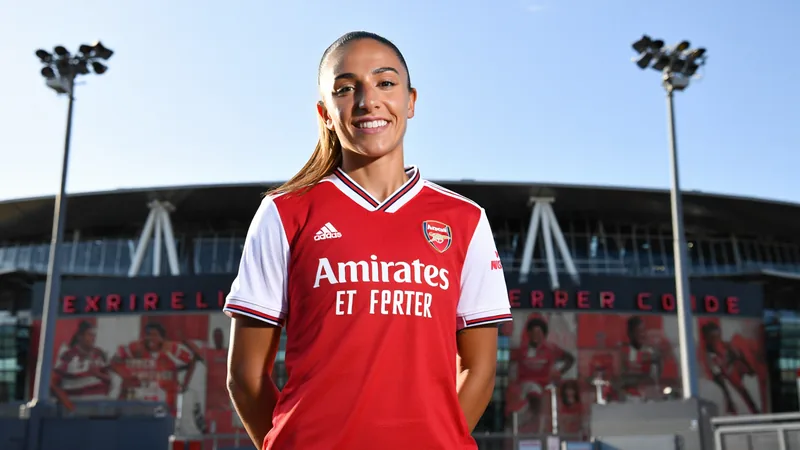 Arsenal sign Germany striker Selina Cerci on free transfer Selina Cerci in Arsenal kit, smiling, with Emirates Stadium in background