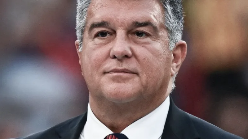 Joan Laporta speaking at a press conference, announcing the signing of Karim Adeyemi.