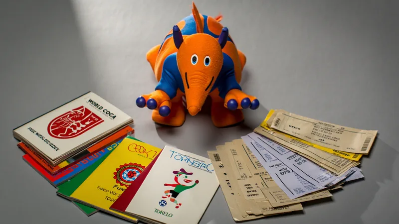 A collection of World Cup memorabilia including a mascot, tickets, and programmes from various tournaments between 1966 and 2010.