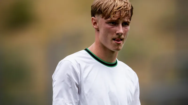 Borussia Mönchengladbach logo and young player Edin Biber in first-team training kit