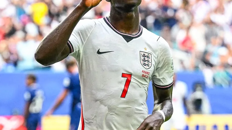 Bukayo Saka Named Man of the Match for England vs France Bukayo Saka holding a Man of the Match award on the pitch after the England-France match