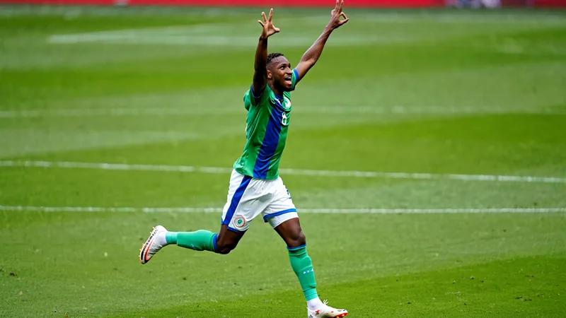 Soccer player Deroy Duarte celebrating after scoring a goal for Cape Verde against Argentina in a World Cup match. — latest news and analysis.