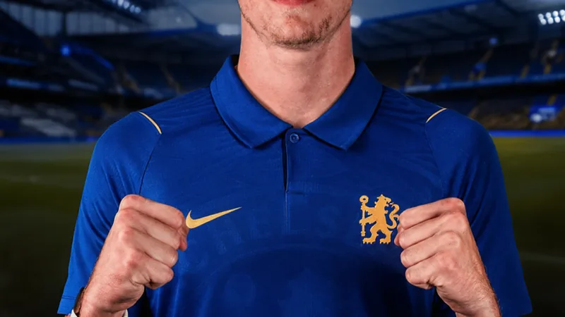 Chelsea agree deal to sign Harrison Bettoni from Wigan Chelsea logo and a young footballer in action, representing the signing of Harrison Bettoni
